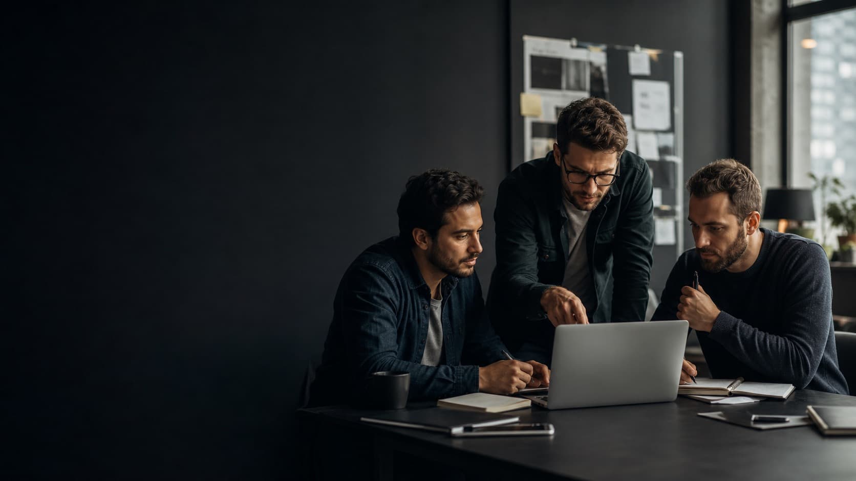Three men collaborating on a practical AI project